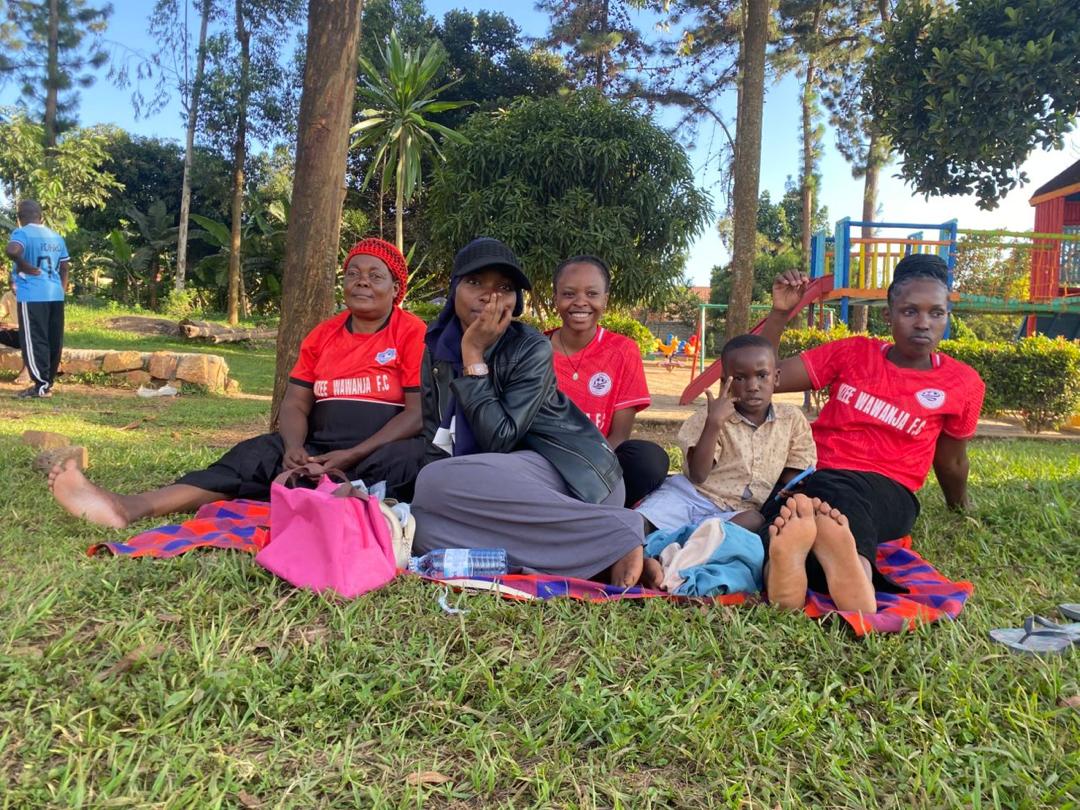 Club members and family relaxing together outdoors