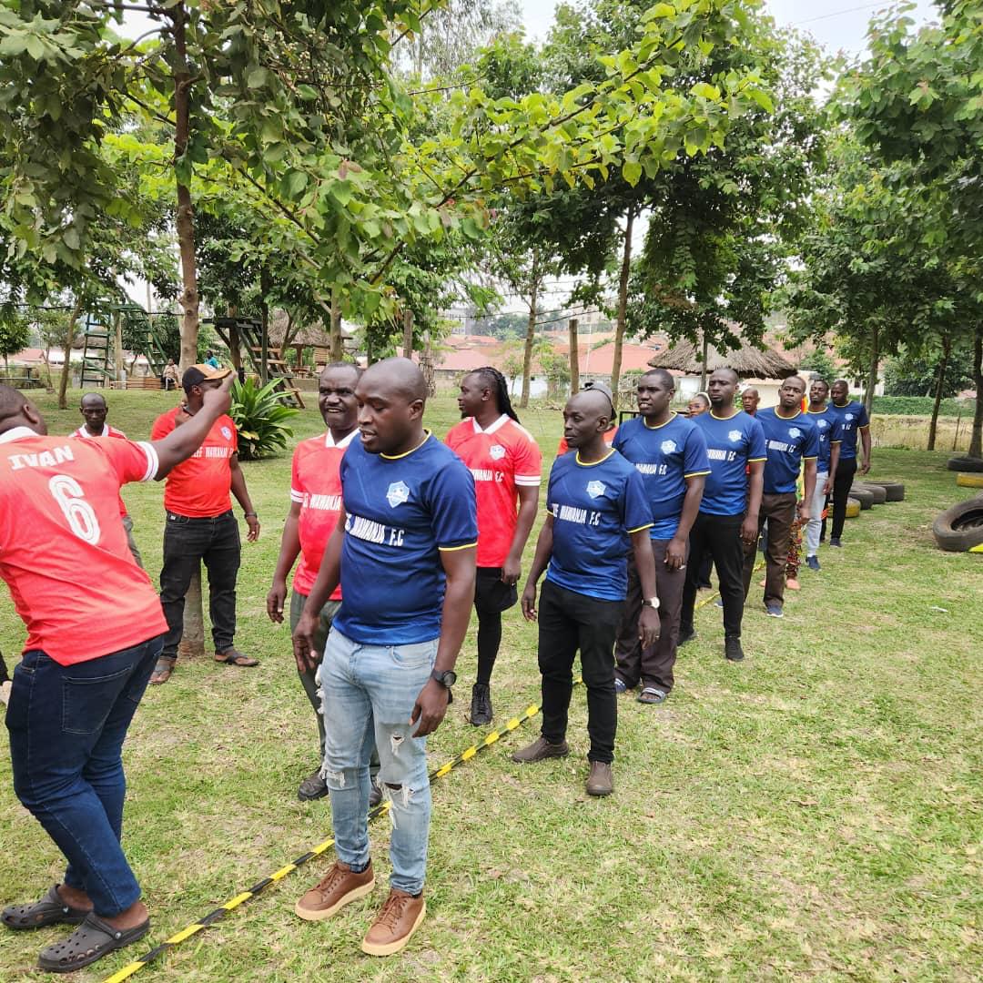 Red and blue teams lining up during a club activity